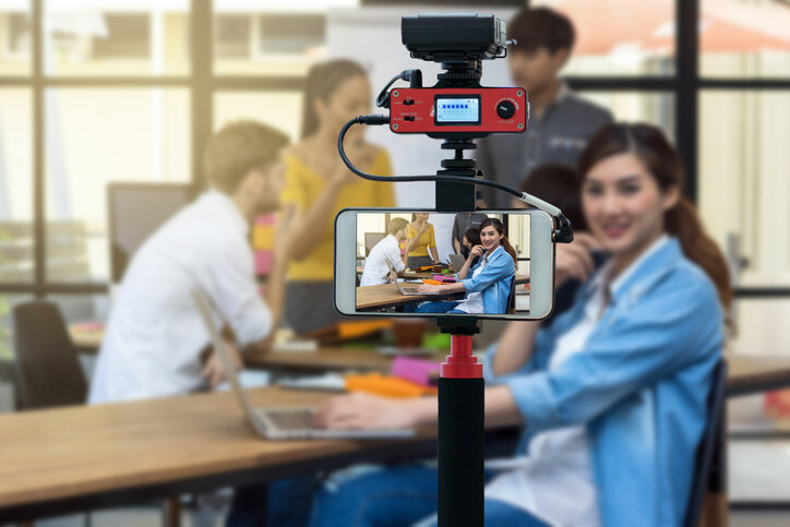 Closeup smart mobile phone taking Live of Businesswoman working with Group Of Business people, Camera for photographer or Video and Live Streaming concept